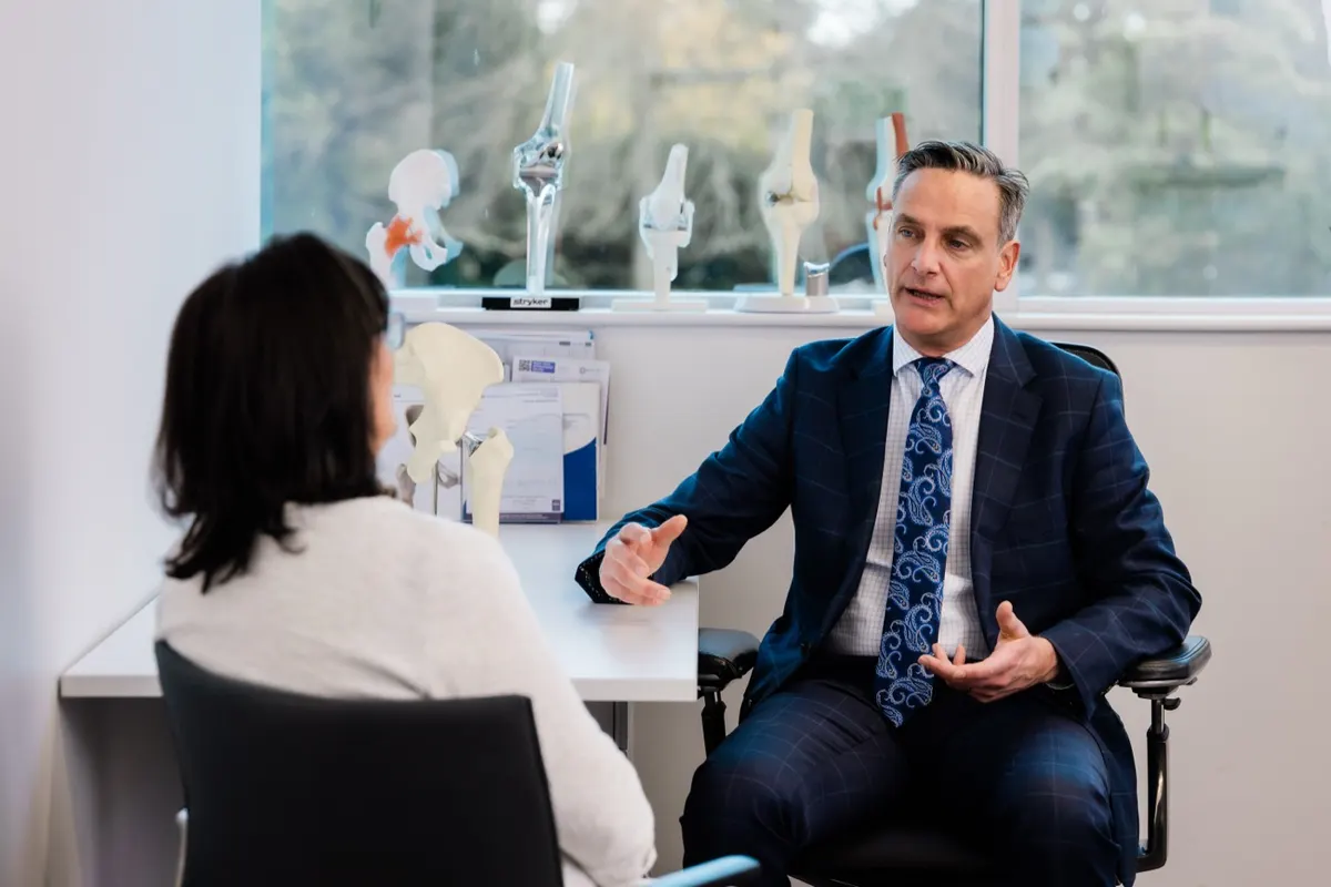 Dr John Limbers in consultation