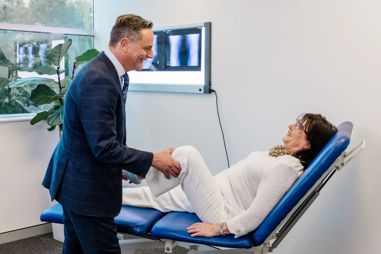 Dr Limbers reviewing a hip and knee X-ray